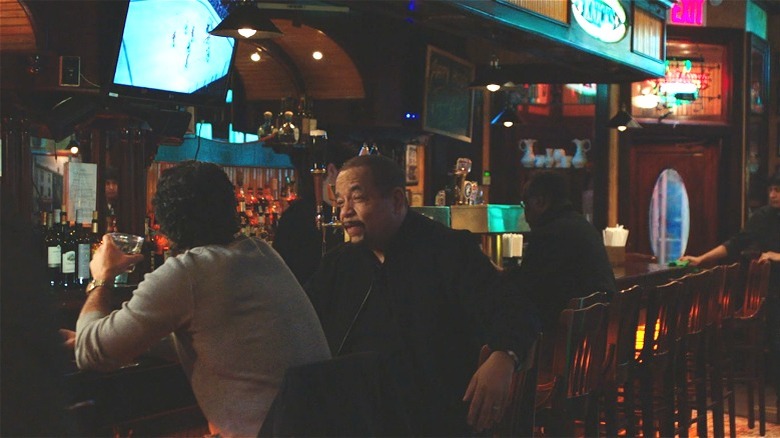 Fin and Bruno talking at a bar 