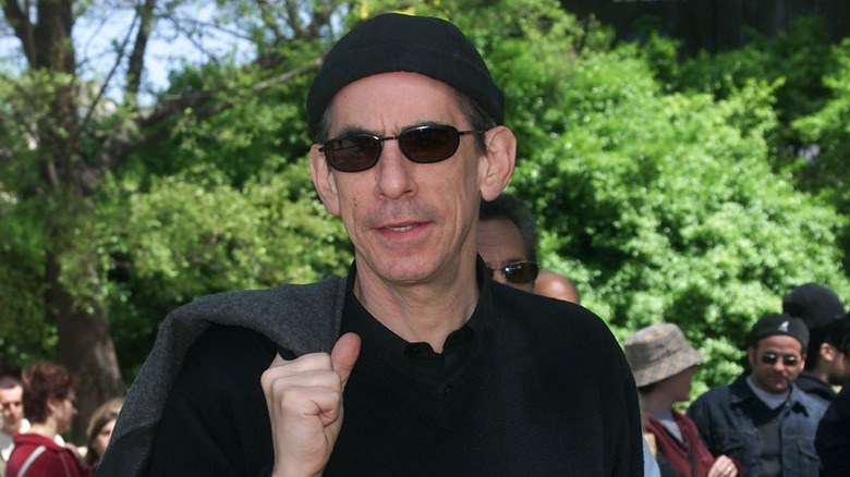 Richard Belzer in park smiling