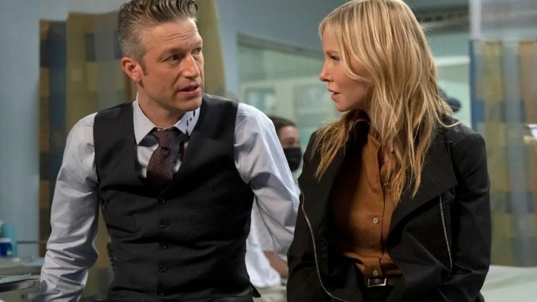 Rollins and Carisi talking