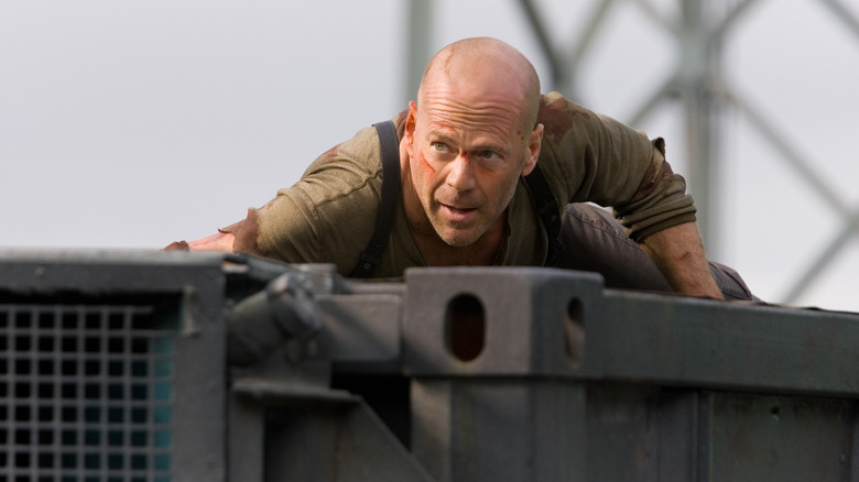 Bruce Willis crawls around