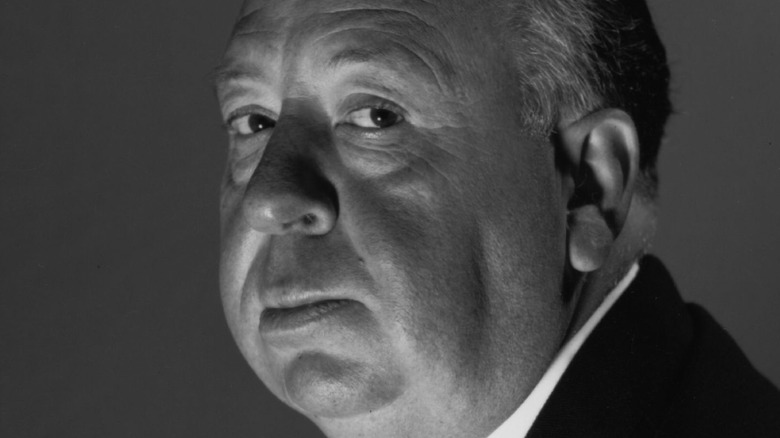 Alfred Hitchcock glowering in London in 1956