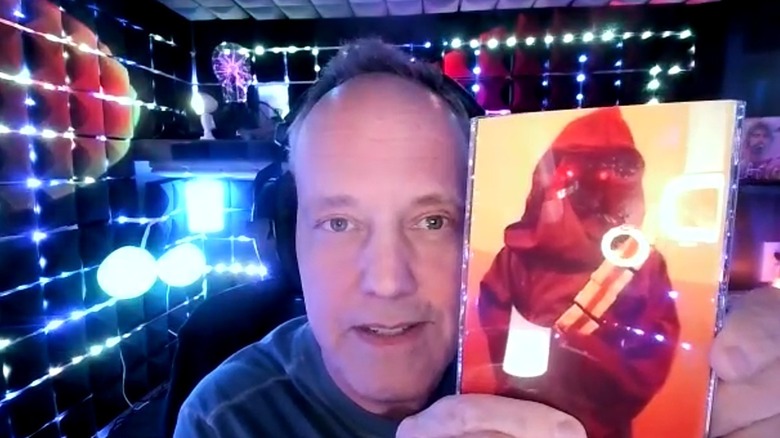 Dee Bradley Baker showing a photo of his Jawa costume