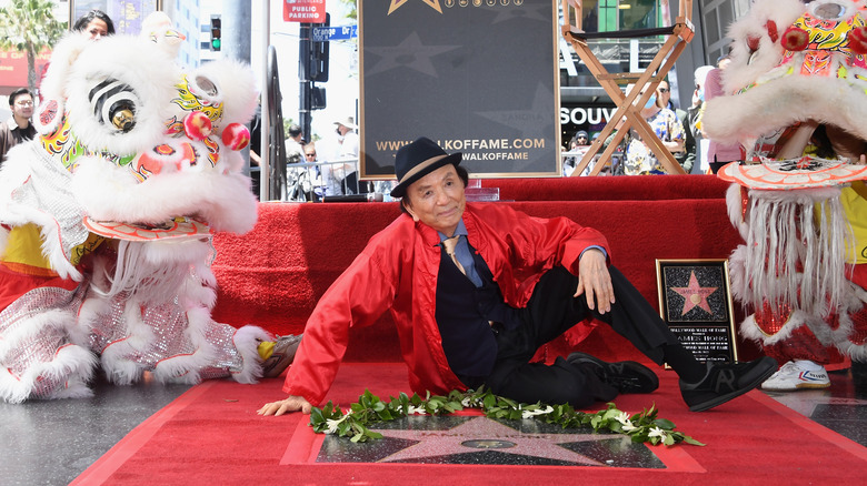 James Hong posing at his Hollywood Walk of Fame celebration in May 2022