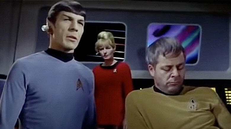 Spock and others standing and sitting