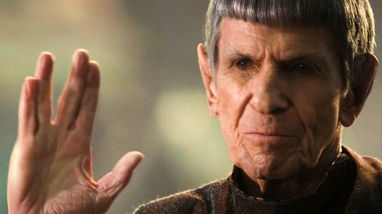 old Spock gives Vulcan salute