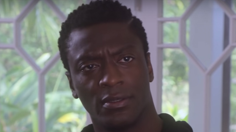 Aldis Hodge in front of window