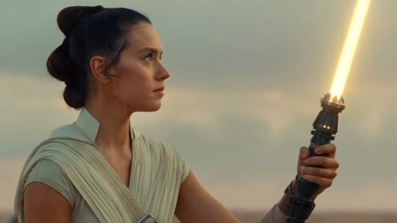 Rey ignites her lightsaber