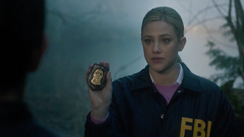 Betty Cooper holding FBI badge