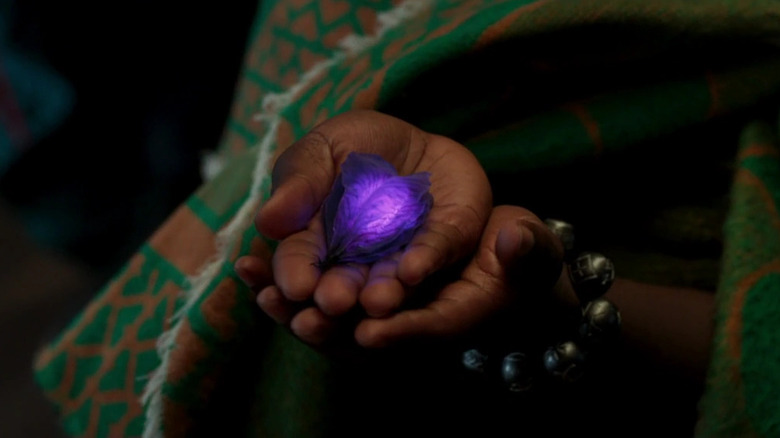 Nakia holding heart-shaped herb