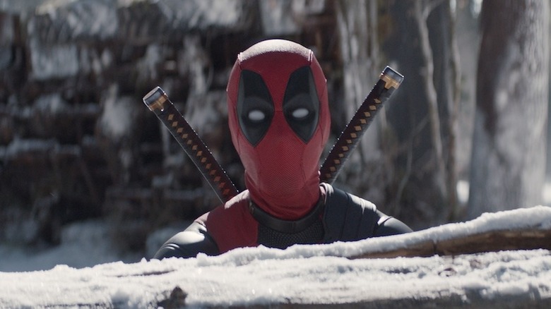 Deadpool behind a tree