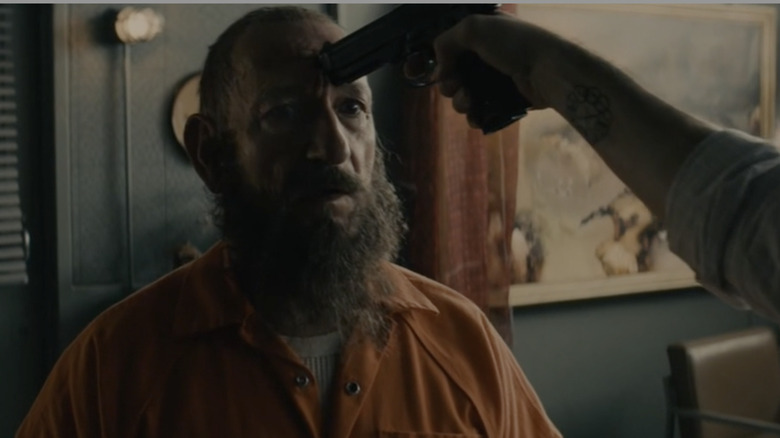 Gun pointed at Ben Kingsley in "All Hail the King"