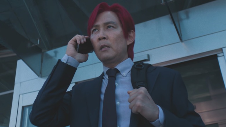 Seong Gi-hun talks on the phone in "Squid Game" (2024)