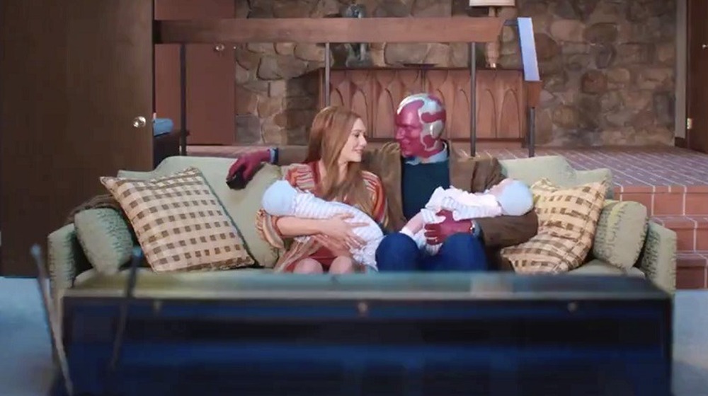 Wanda and Vision sitting on the couch with their twins