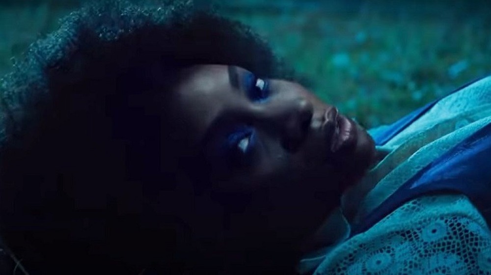 Monica Rambeau lying in a field outside Westview