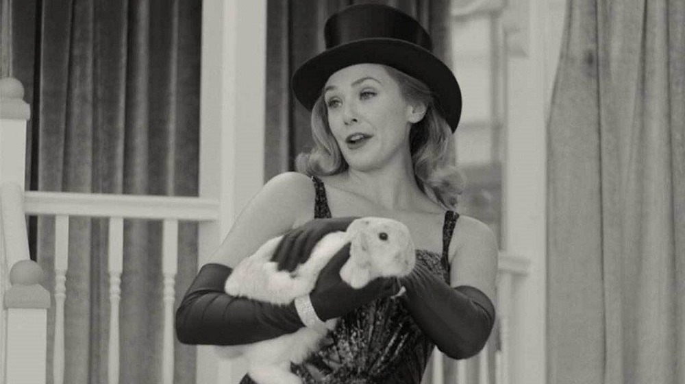 Wanda holds a bunny during Vision's magic act