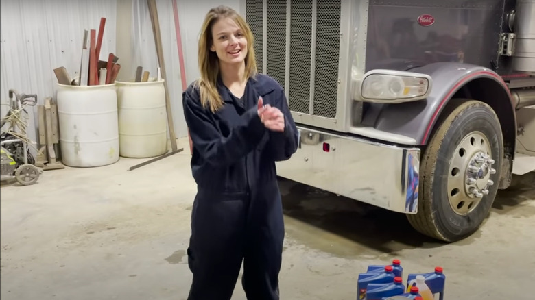 Lisa Kelly does an oil change