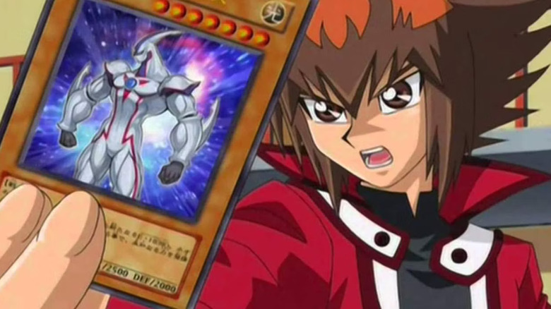 Jaden Yuki holding a card