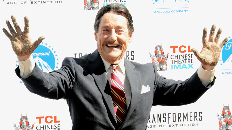 Peter Cullen smiling hands up