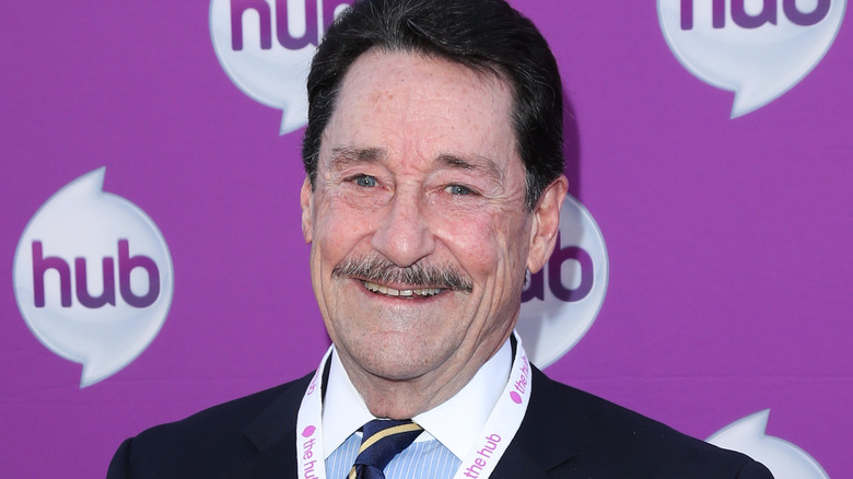 Peter Cullen smiling in suit