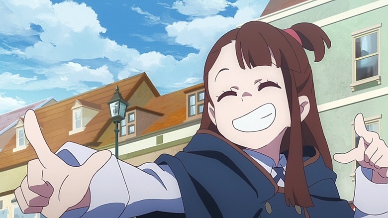 Akko grinning and pointing