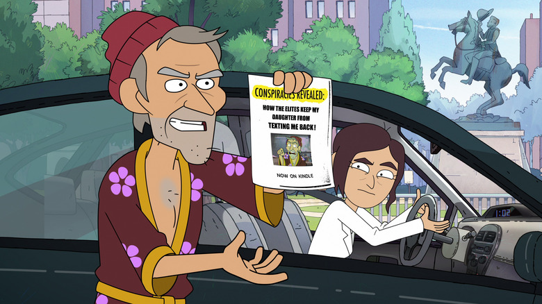 Randy holding up conspiracy flyer