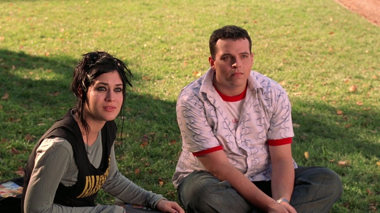 Janis and Damian sitting on grass