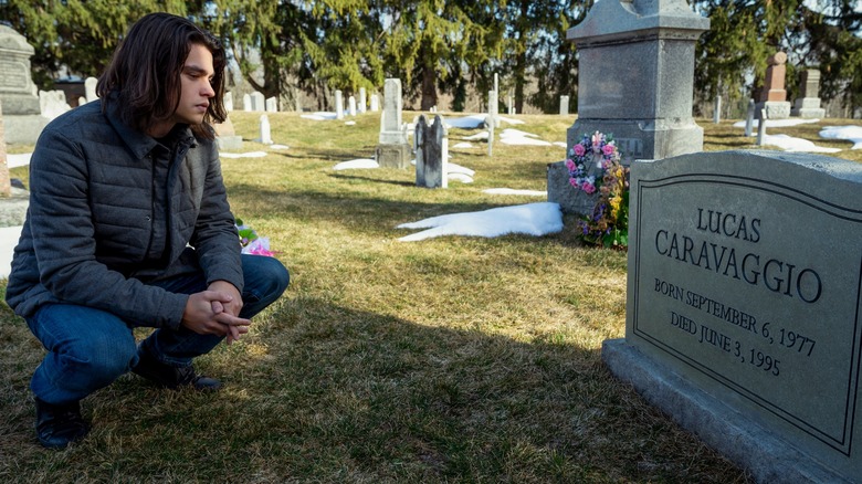 Lucas looking at his grave