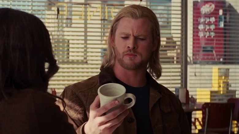 Thor looking at mug