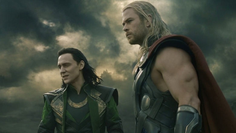 Thor and Loki against stormy sky