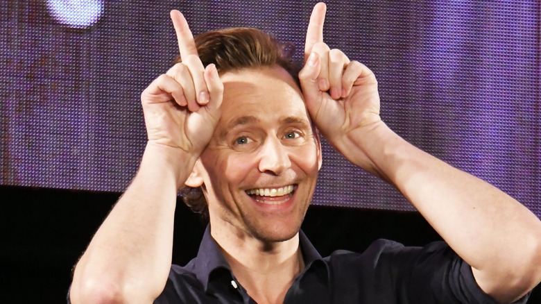 Tom Hiddleston making finger horns