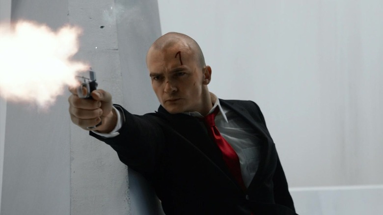 Rupert Friend firing gun