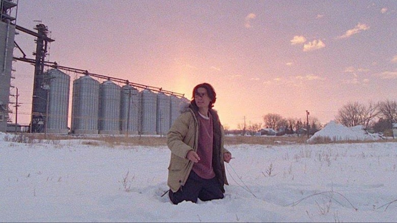 Activist kneeling in snow