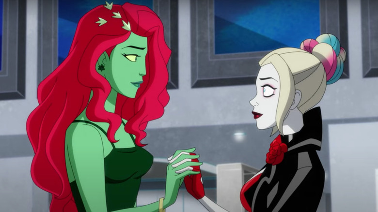 Harley Quinn holding hands with Poison Ivy