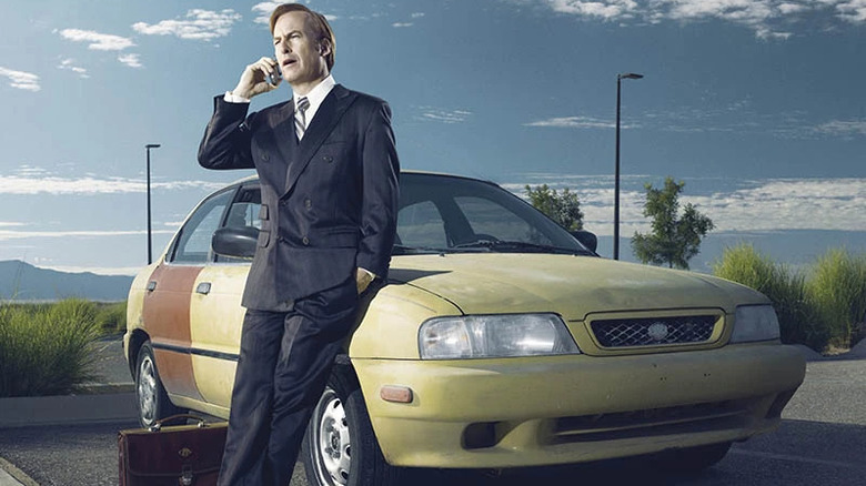 Saul poses with a car