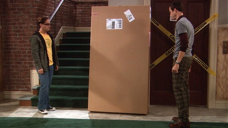 Leonard and Sheldon looking at an Ikea box 