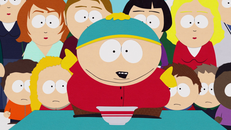 Cartman dances around Mr. and Mrs. Tenorman chili 