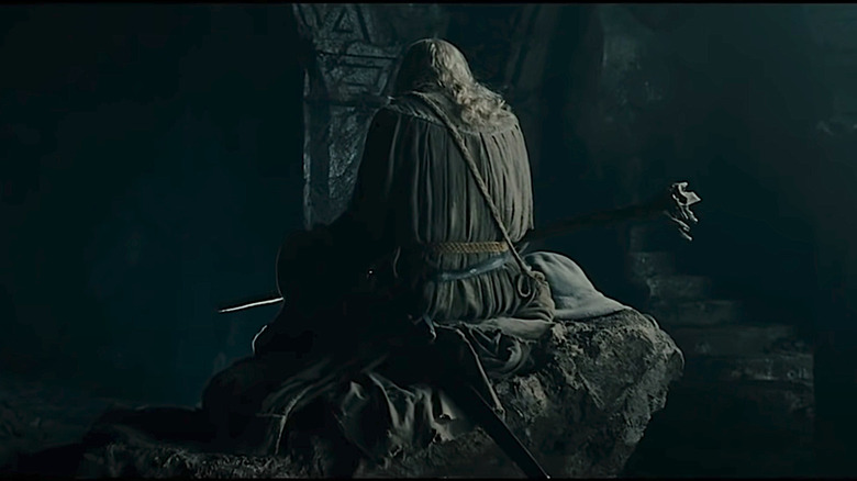 Gandalf sits on a rock