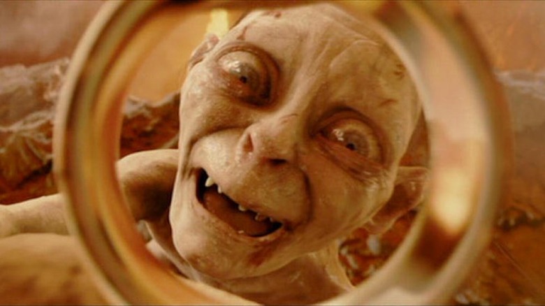 Gollum looking joyously at the Ring