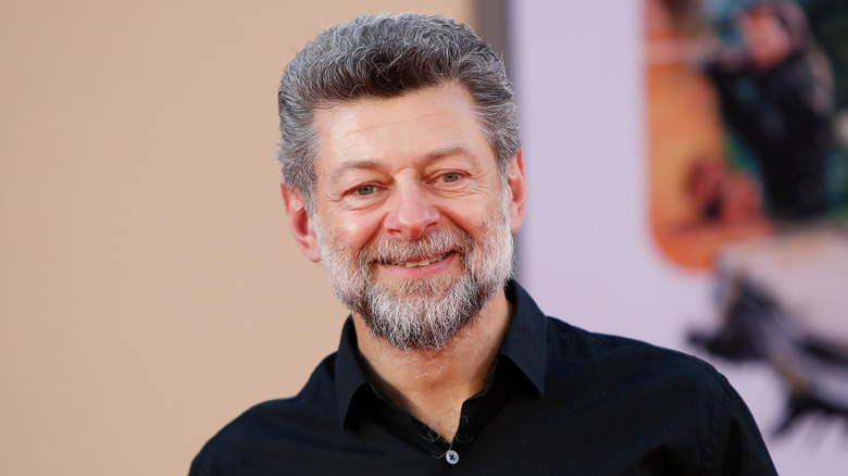 A close up of Andy Serkis smiling