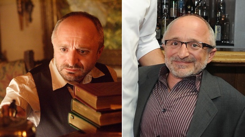 Trick in front of books, rick howland smiles