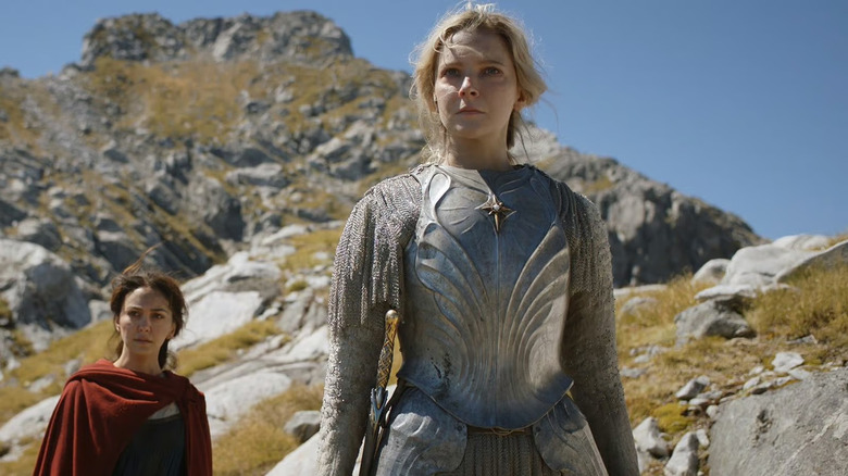 Bronwyn and Galadriel stand in front of a mountain