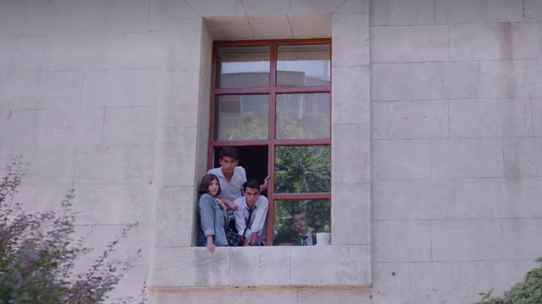 The students looking out a window 