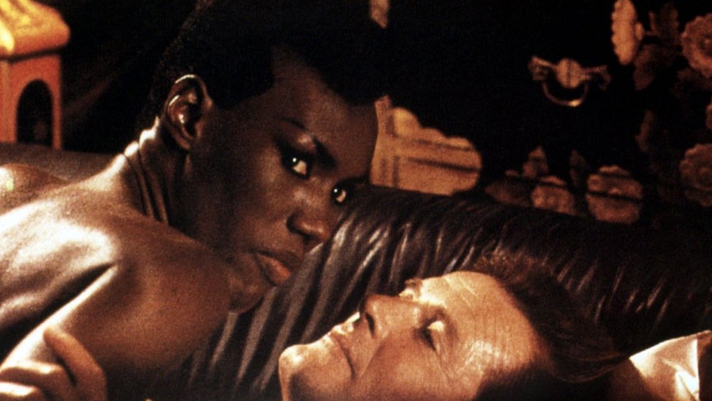 Grace Jones as May Day in a love scene with Roger Moore as James Bond in A View to a Kill