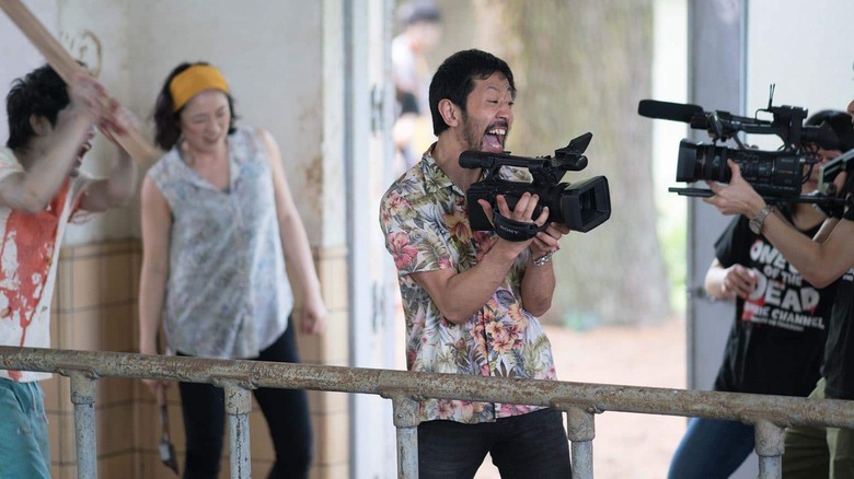 Takayuki Hamatsu aims a camera at a camera in One Cut of the Dead