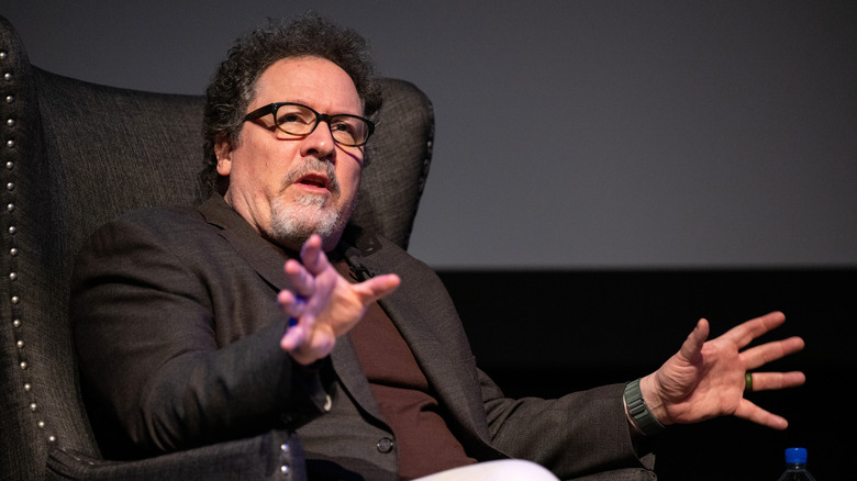 Jon Favreau sits in a chair