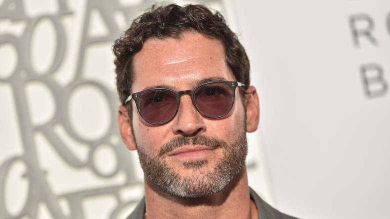 Tom Ellis rocking black shades