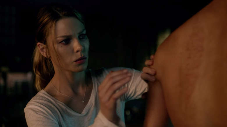 Chloe is concerned looking at Lucifer's scars