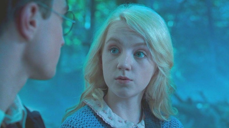 Luna Lovegood looking at Harry Potter