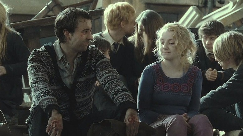 Neville Longbottom and Luna Lovegood sitting together
