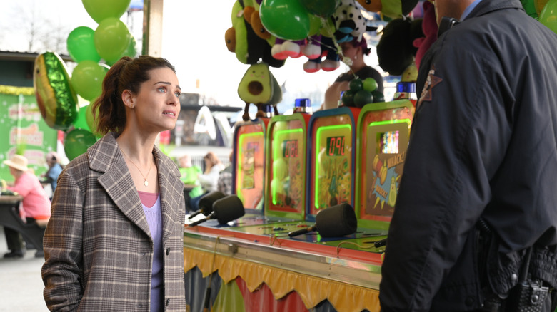 Laura looking desperate at a fair